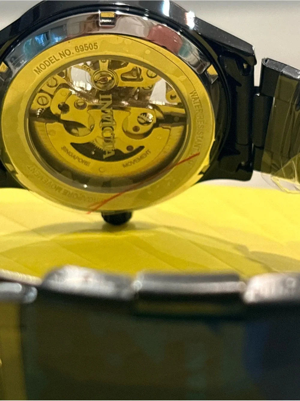 Invicta Men’s Black and Gold Skeleton Mechanical Watch